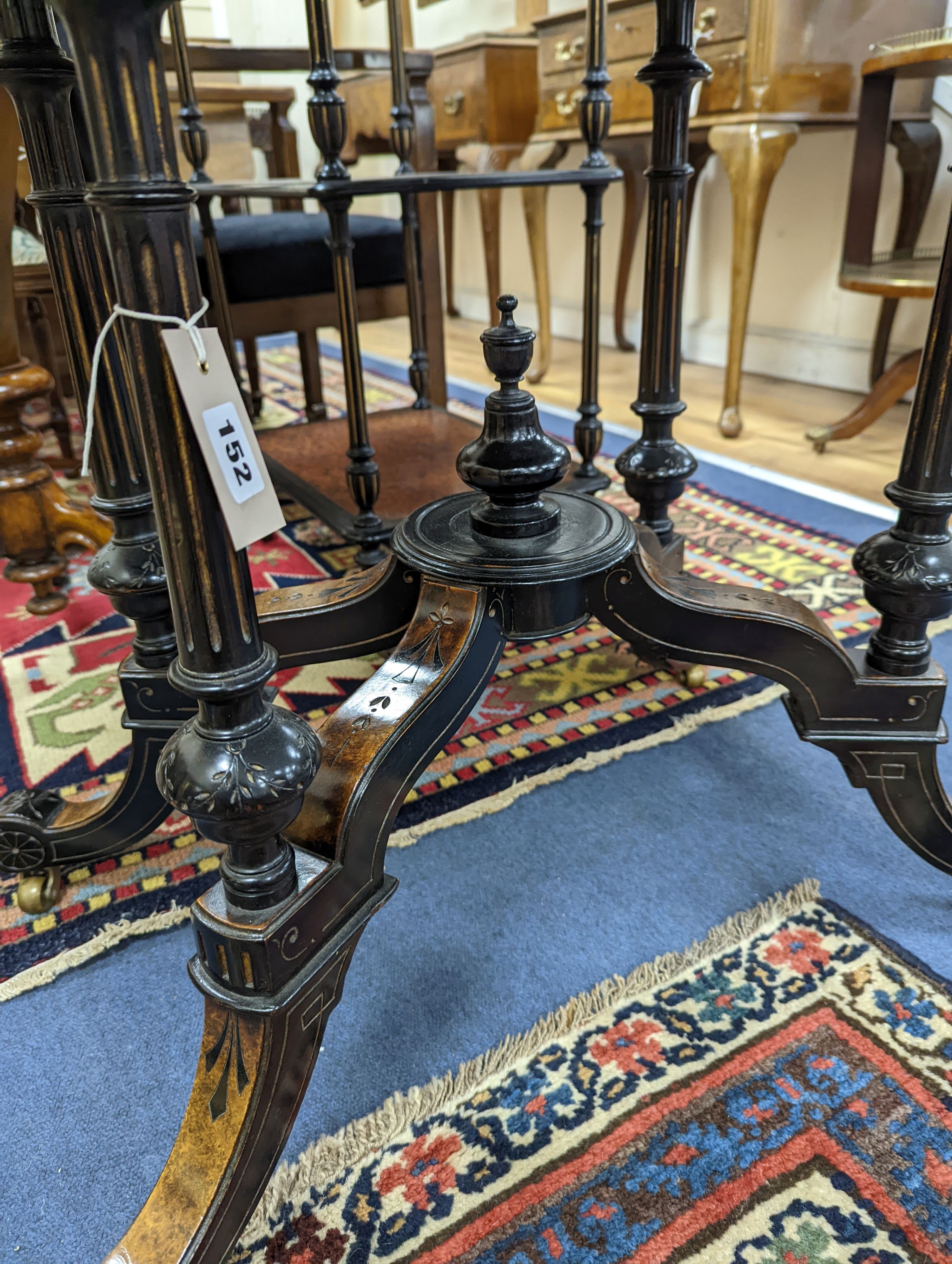 A late Victorian part ebonised oval Amboyna centre table, width 90cm, depth 60cm, height 69cm